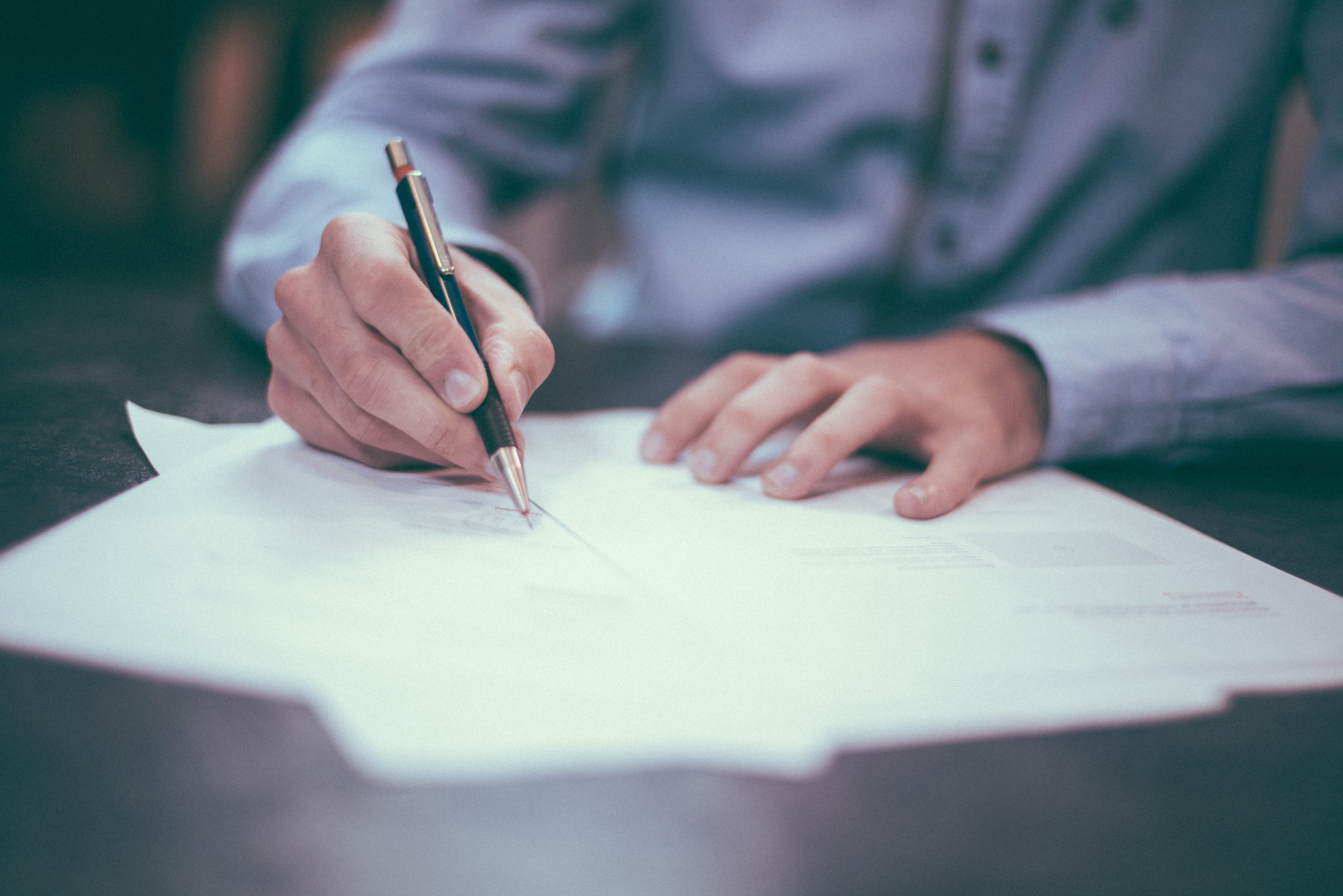 Man writting documents