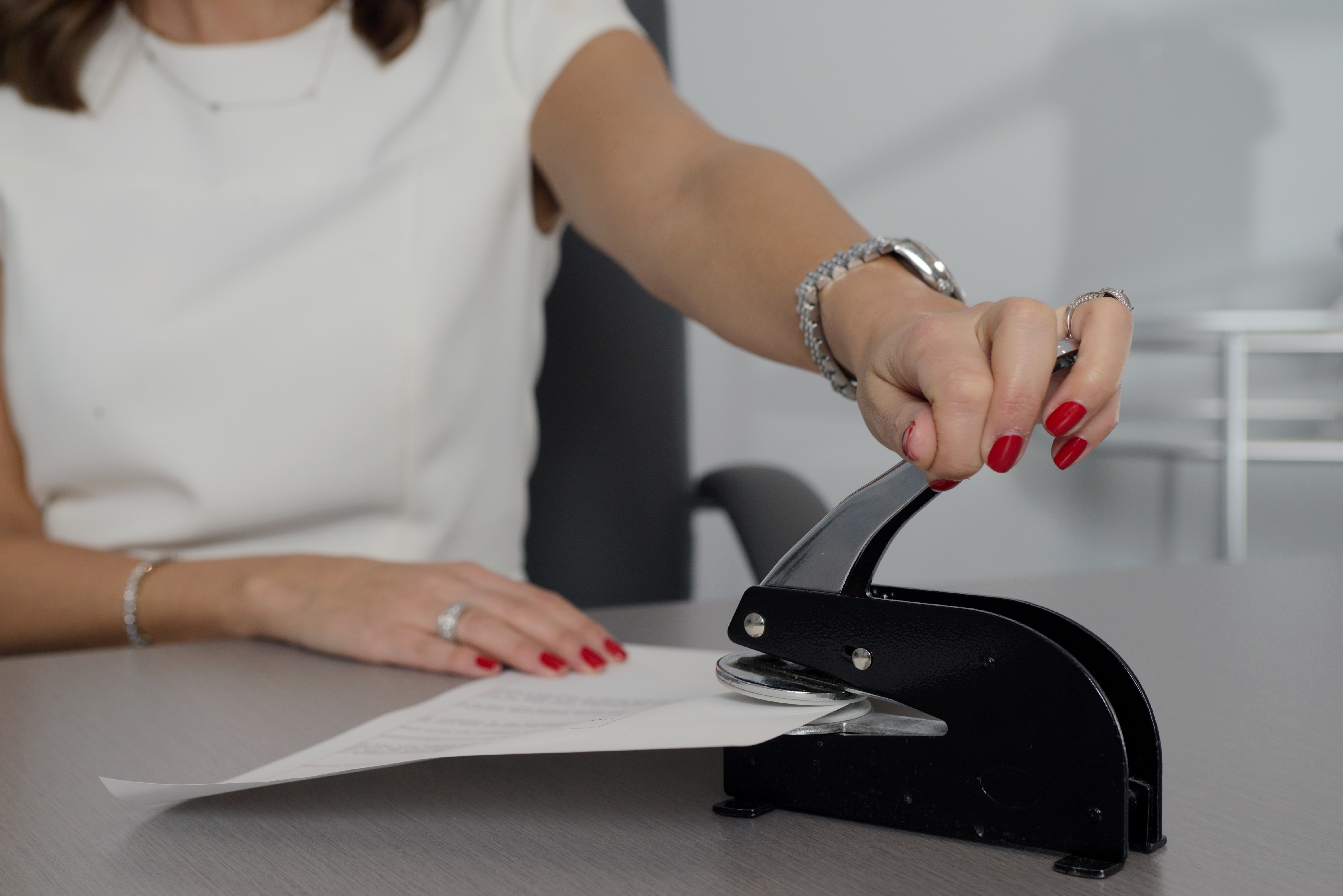 Woman stamping documents